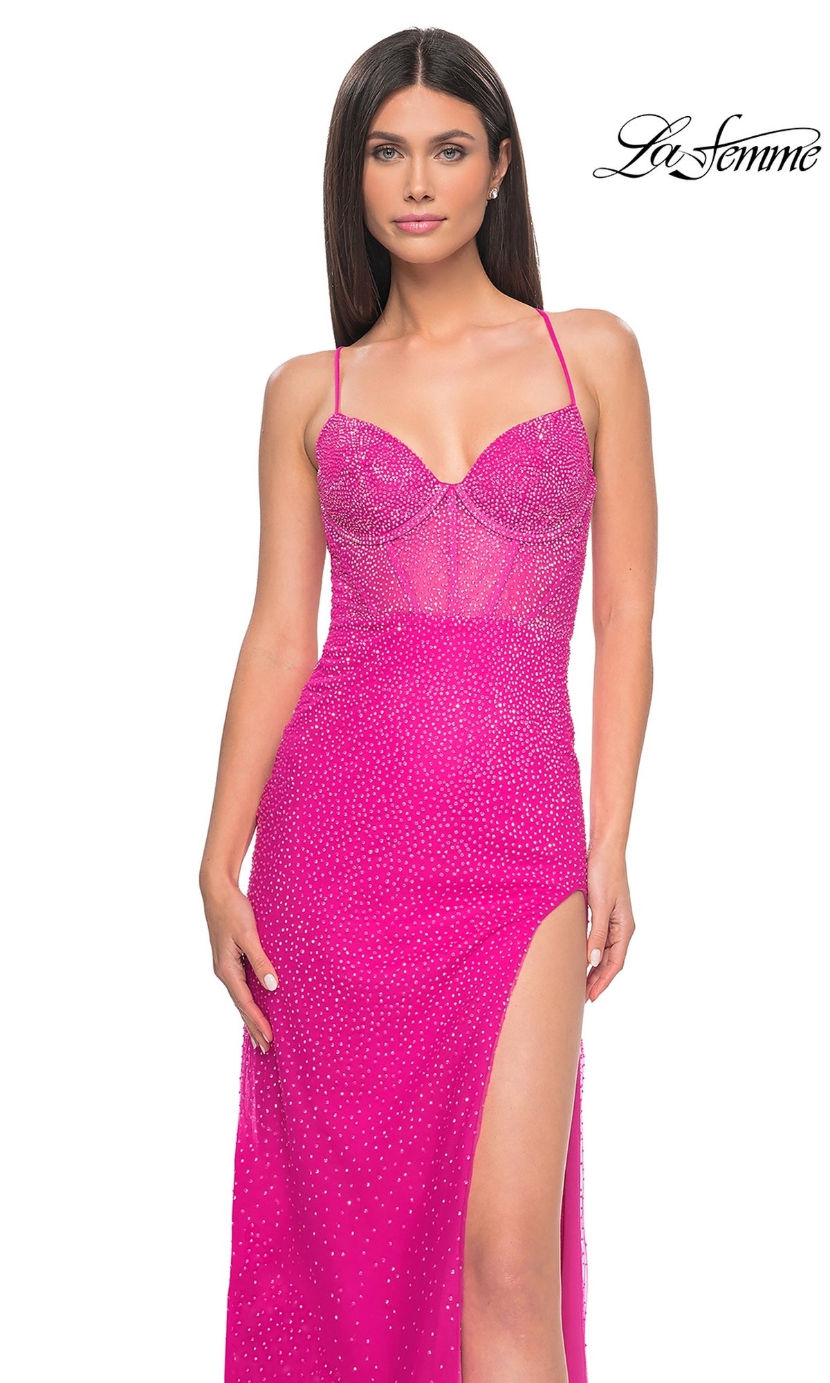 Woman wearing La Femme Cut-Out Long Beaded Prom Dress 32328—a bright pink, fitted, sleeveless gown with thin straps, a high slit, sparkling embellishments; La Femme logo in the top right corner.